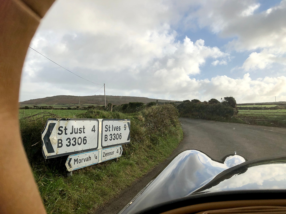 A Cornish road viewed through a car windscreen