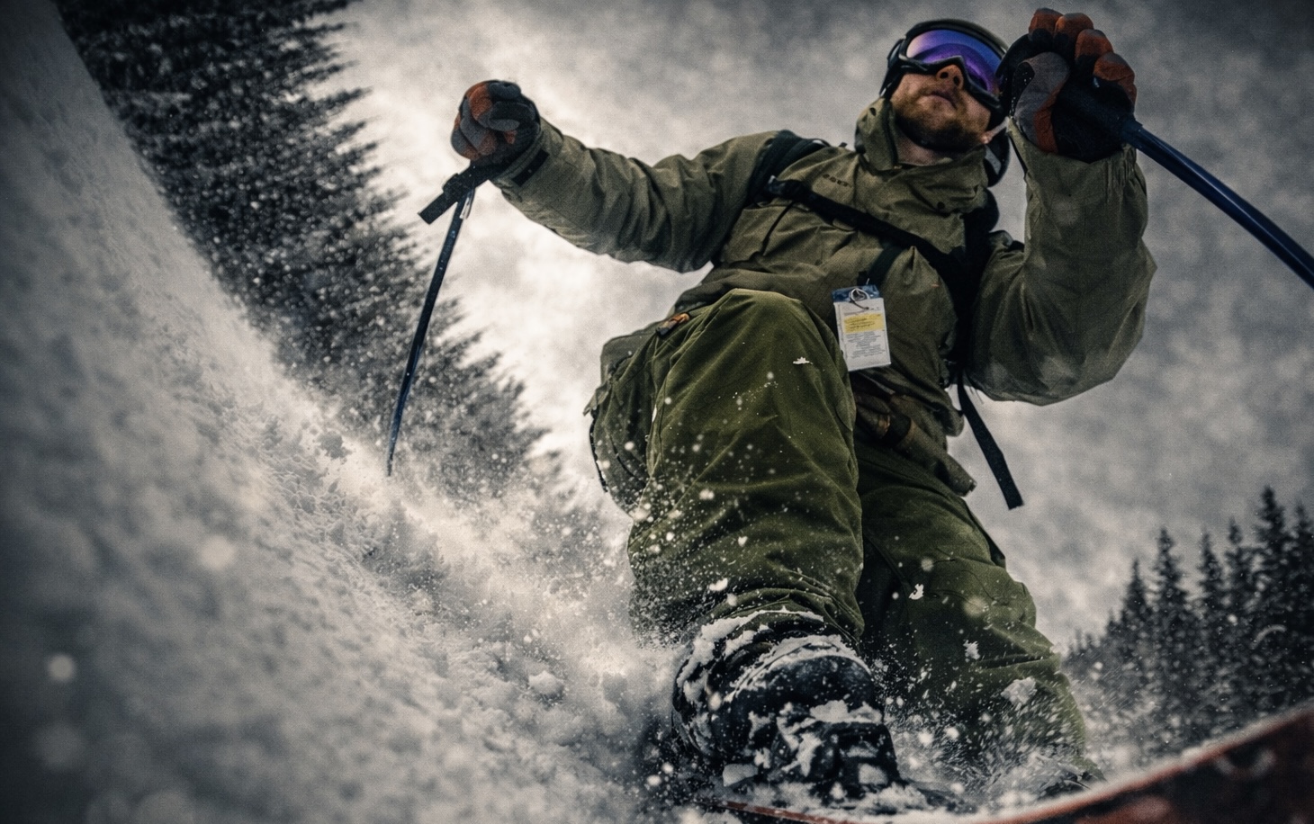 Skier carving through fresh powder snow on a winter mountain