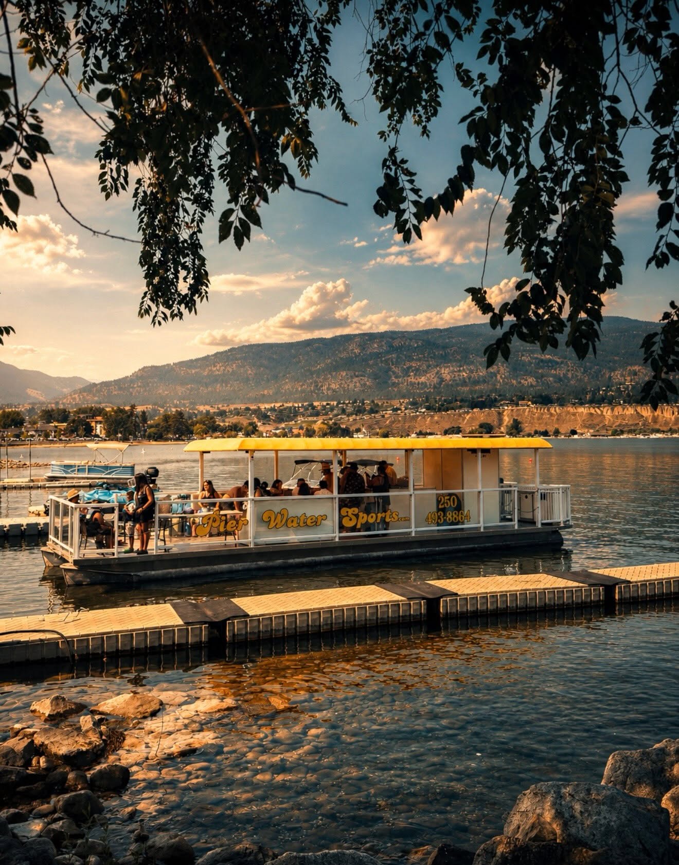 Pier Water Sports party barge photographed on Okanagan Lake in Penticton, presenting lifestyle content and tourism marketing by Life Uncharted Studio
