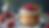 Close-up view of a beautifully layered cake jar with creamy frosting and fresh berries