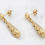 Thumbnail: 14 karat yellow gold sparkly tear drop stud earrings