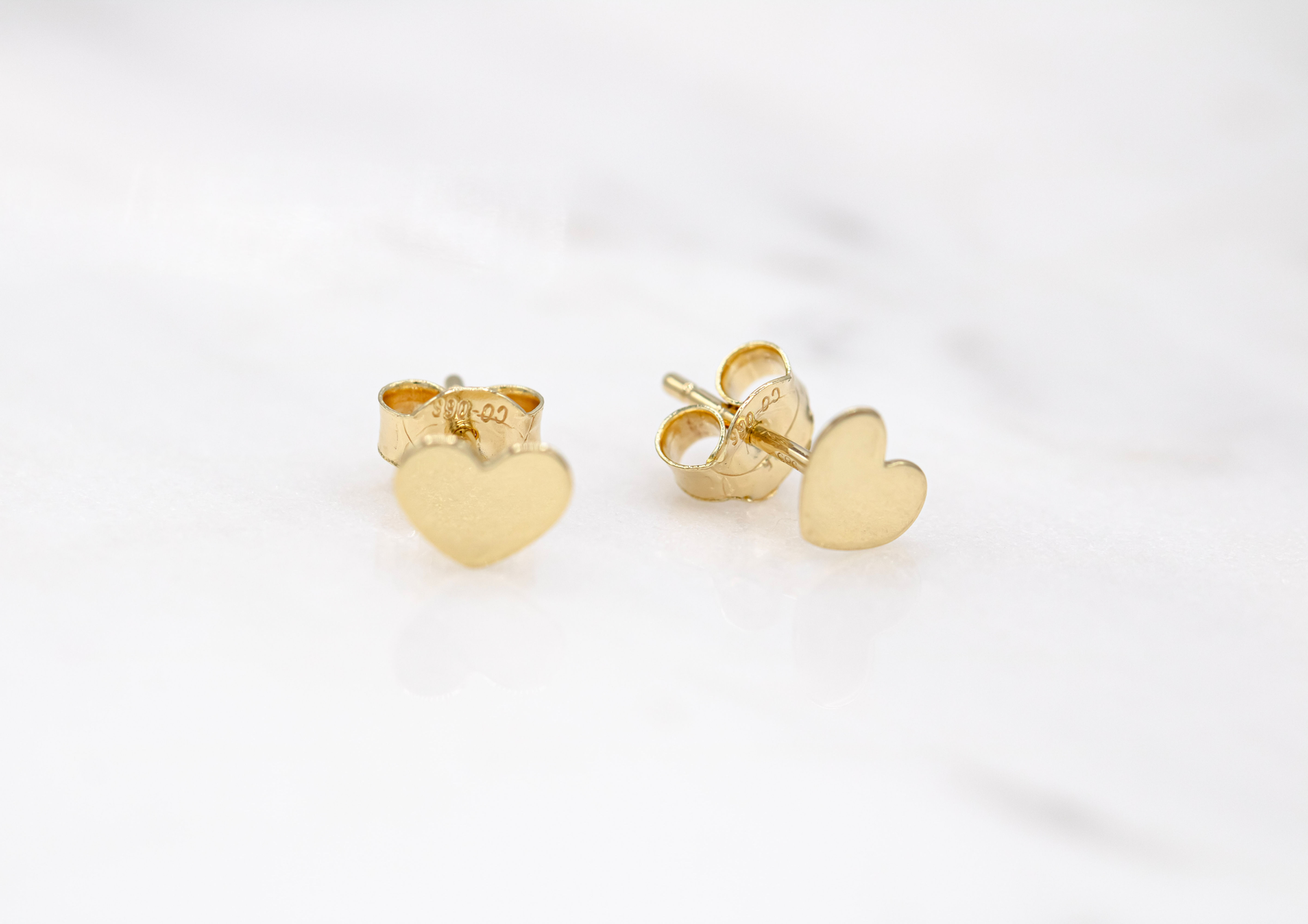 14 karat yellow gold tiny heart stud earrings