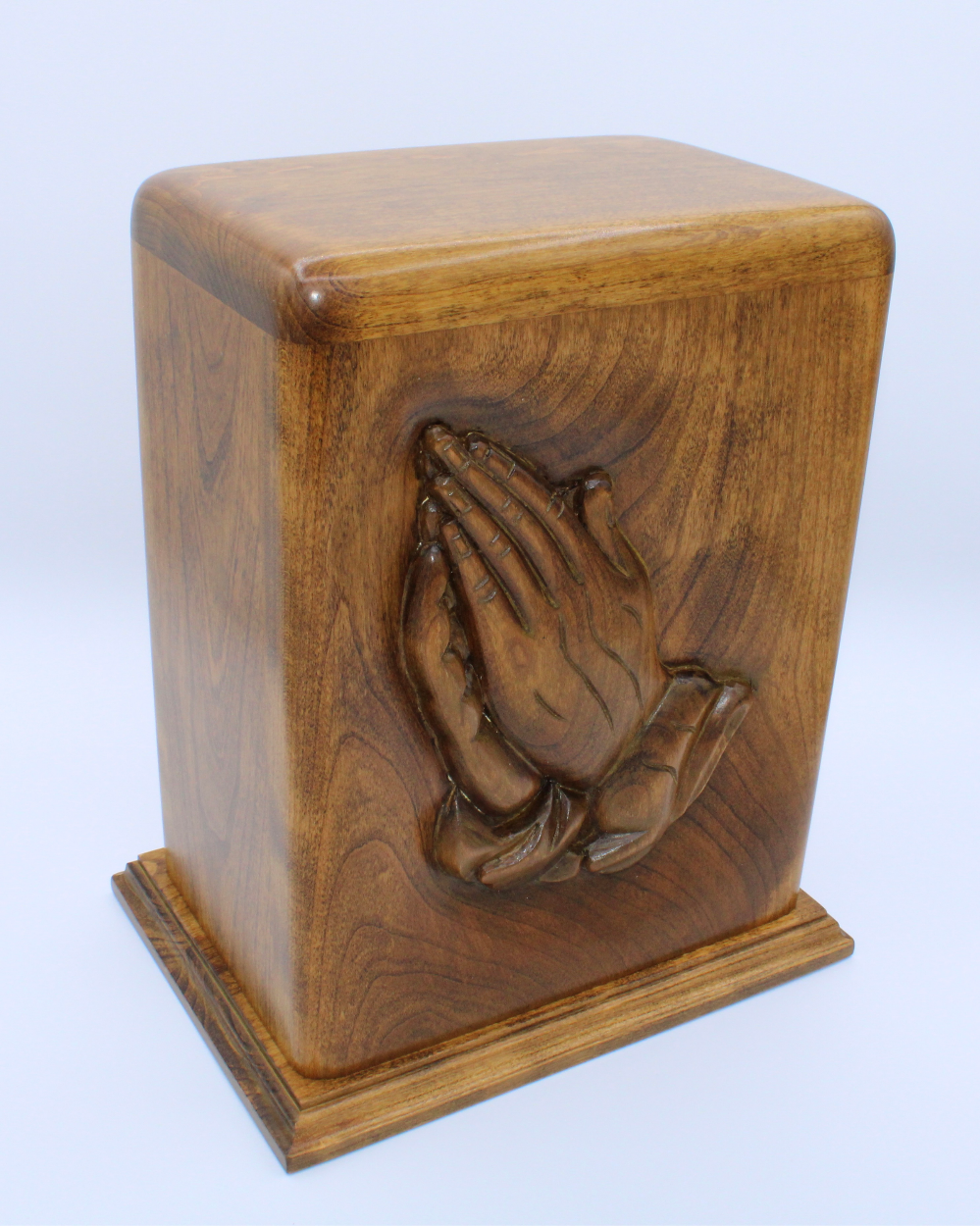 hand carved praying hands wooden cremation urn