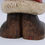 Thumbnail: bottom of paws view of wood carved santa bear