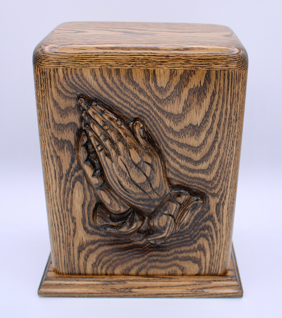 hand carved praying hands wooden cremation urn front