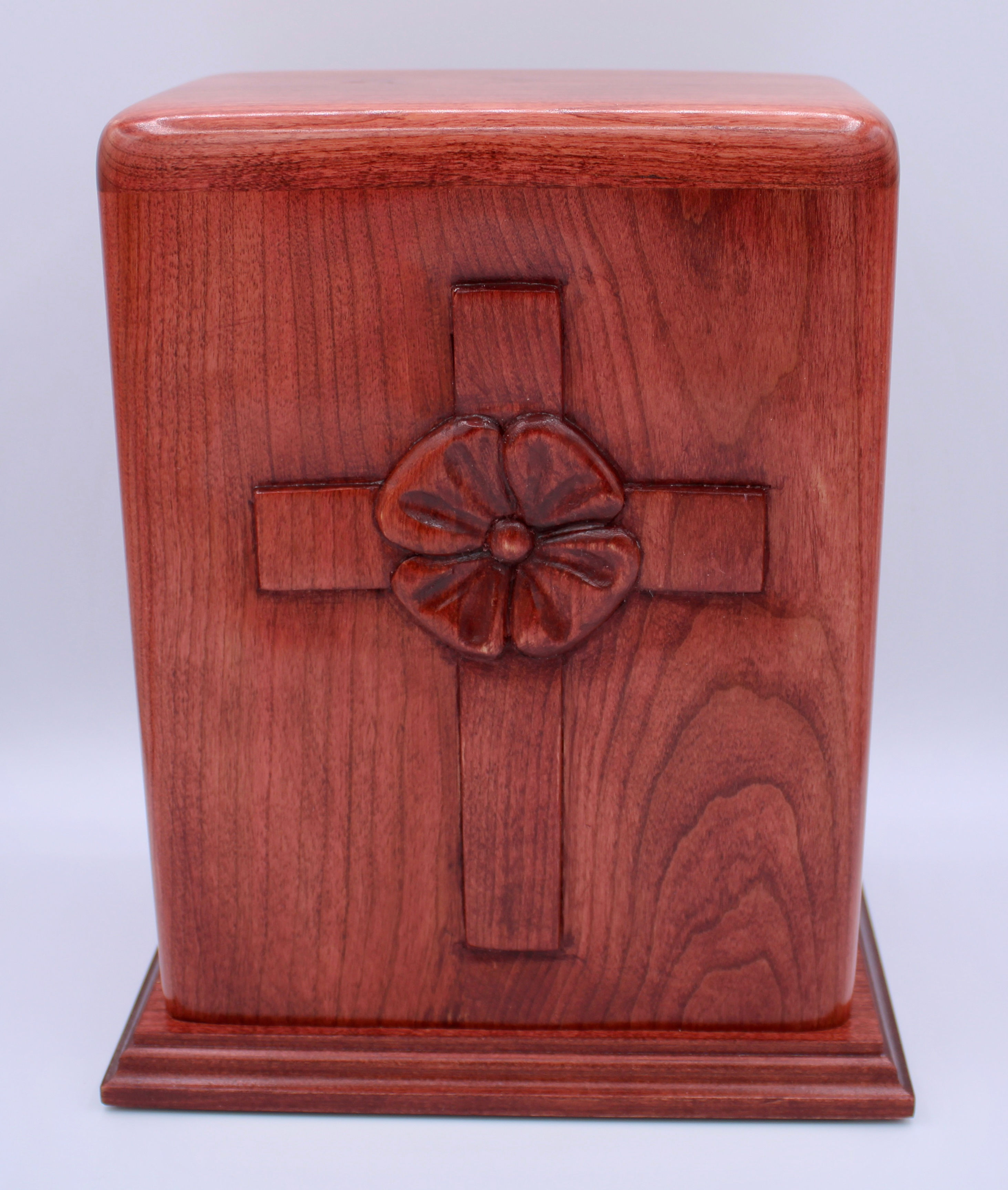 carved poppy in cross cremation urn