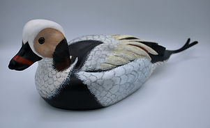 side view of hand carved old sqauw duck decoy 