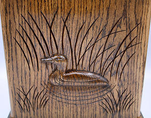 carved Loon companion urn close up