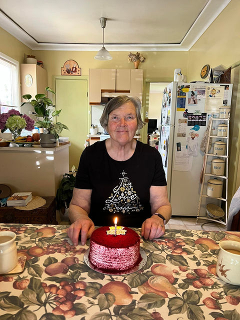 Vicki Andrews with Birthday cake.jpg