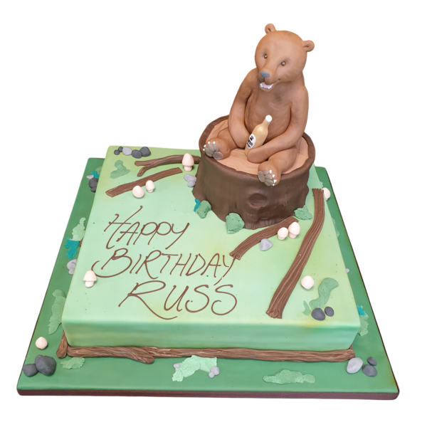 A whimsical and unique cake shaped like a bear holding a beer bottle, perfect for a fun and themed celebration in the UK. Great for parties and special occasions.