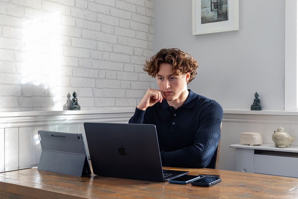Callum Ridgers focused on his laptop, working on Zultancy