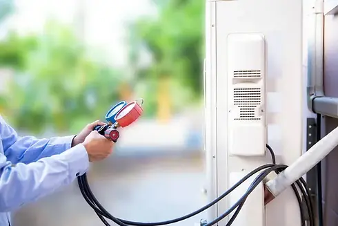 close-up-hand-technician-using-manifold-gauge-filling-air-conditioners+(1)-640w.jpg