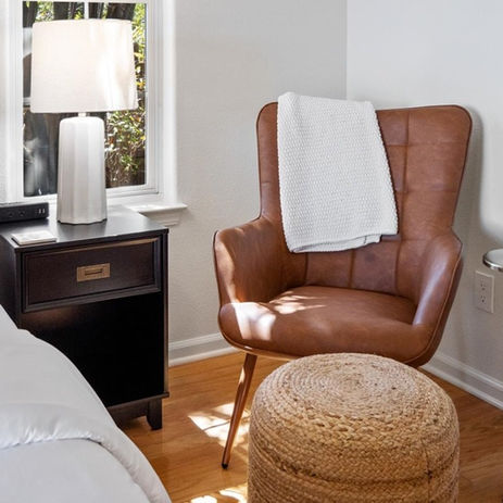 Bedroom sofa with throw blanket