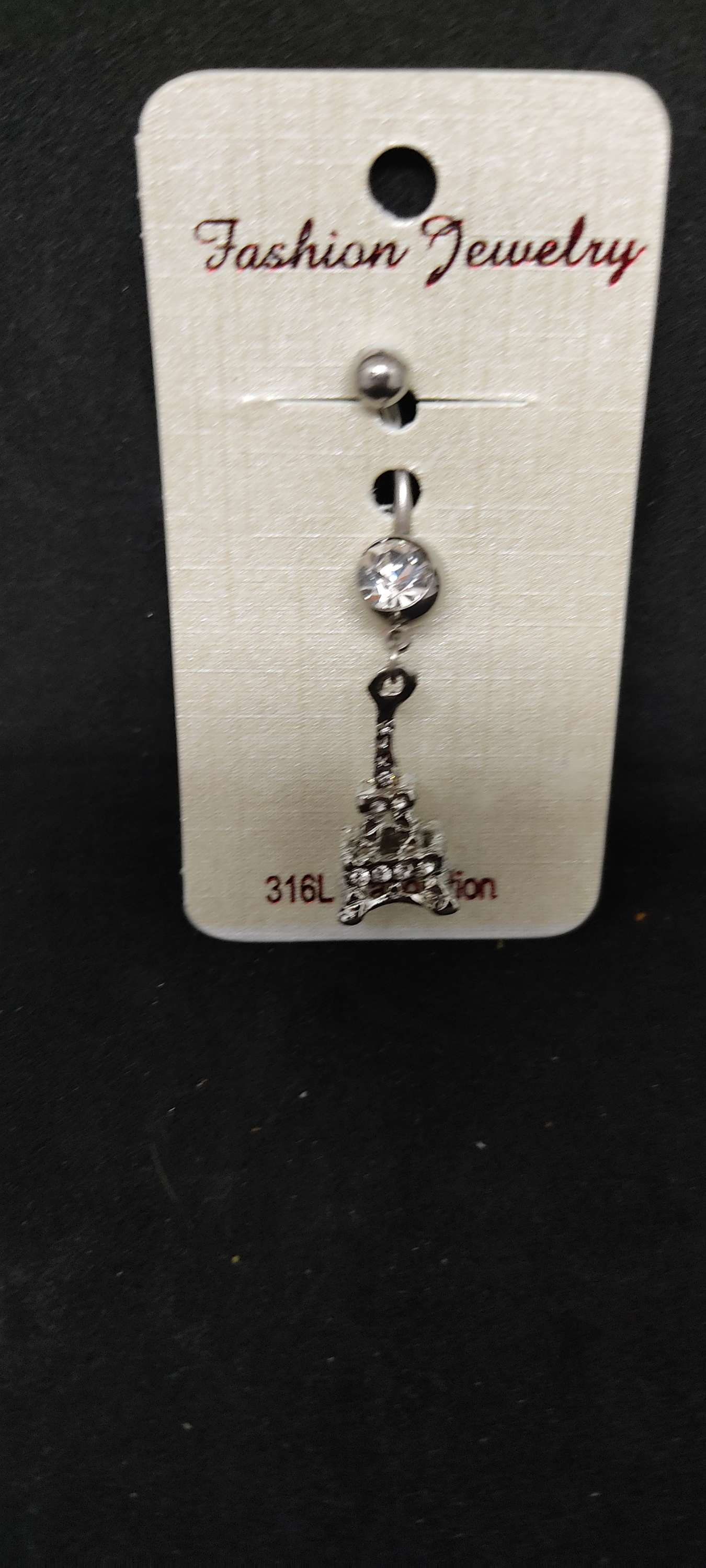 Piercing nombril tour Eiffel 