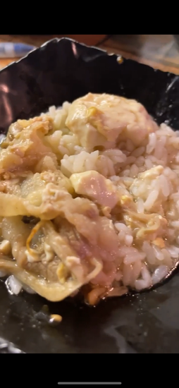 Up close icture of soft tofu stew with beef and rice 