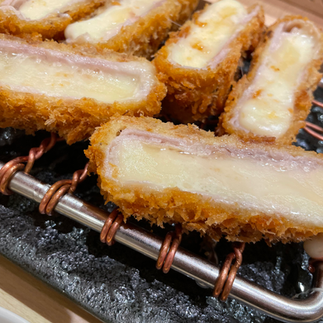 Zoomed In Photo Of Cheese Katsu