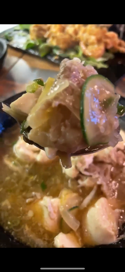 Upclose picture of soft tofu stew with beef