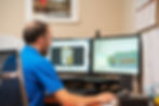 JSI team member designing equipment in CAD software