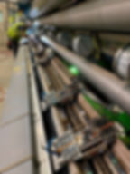 Maintenance tech working on a winder in a paper mill