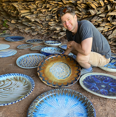 Joseph Sand with ceramic platters May 2022.heic
