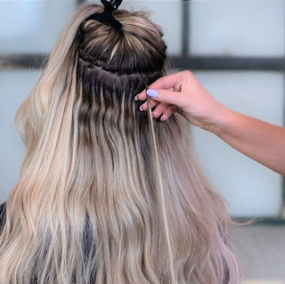 Hannah from Blended Lengths fitting Nano Bead Extensions to a Clients Hair