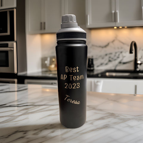 Laser engraved water bottle with logo and team member name.