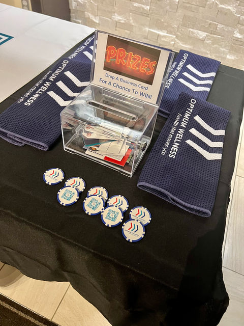 Table with Custom Printed Golf Towels and Poker Chips