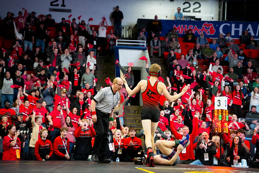 St. Louis’ Owen Fogel pumps up the crowd after his win at the 2025 MHSAA Team State Wrestling Finals. Picture by Travis Long | TBM Team
