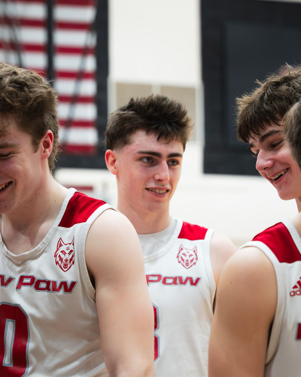 Truman Brennan and teammates laugh in the huddle on friday night photo by Brady Triemstra | Team TBM