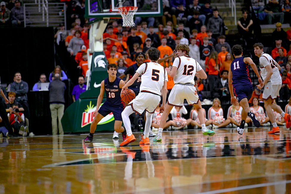 Eli Wolfe trying to make something happen as he sets up the play for rockford. Photo By Chris Carpenter