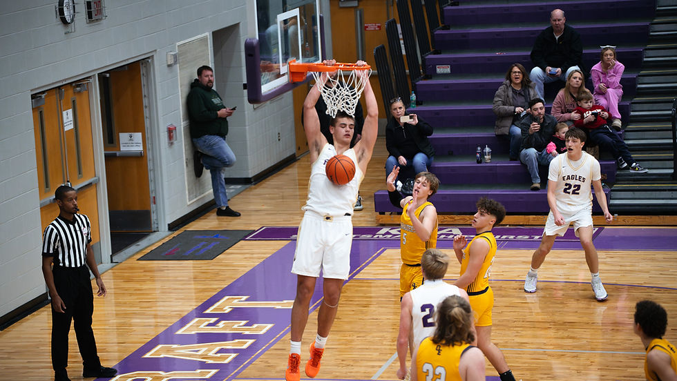 Jimmy Miller slams down a powerful dunk early in the 2nd qtr photo by Brady Triemstra | Team TBM