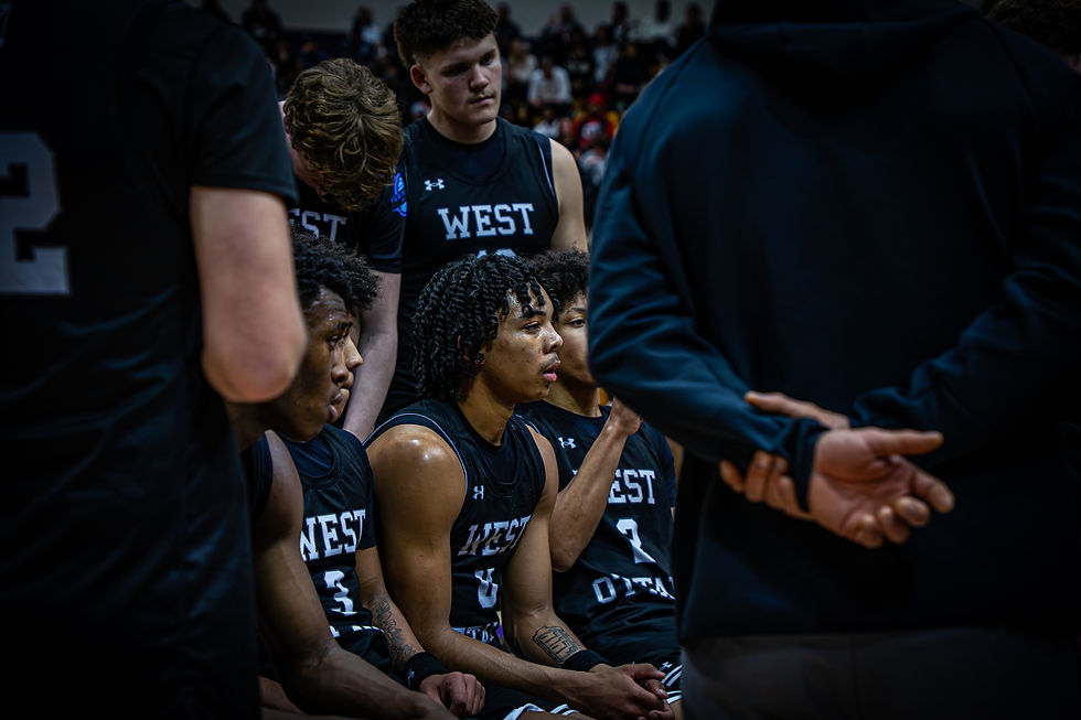 Makai Campos sits on the bench Tuesday night during a timeout. Photo by Nathan Fears
