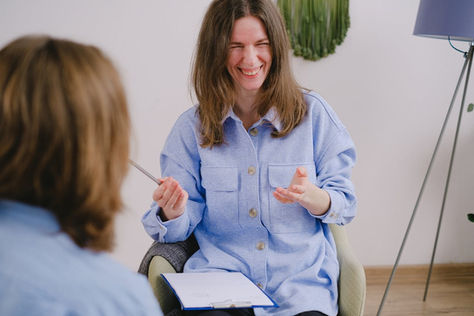 Therapist talking with a client during a session about treatments for attention deficit disorder and next-step care planning.