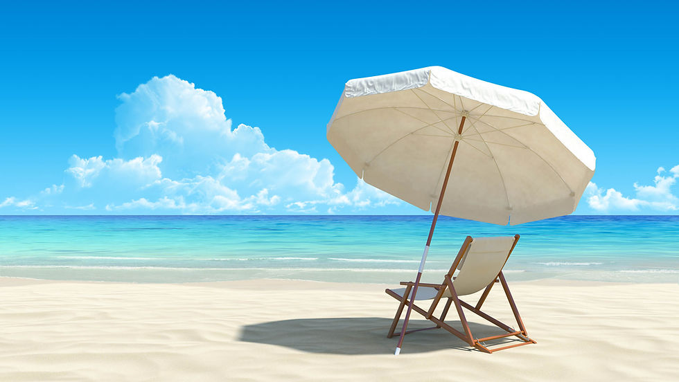 A beach scene with a white umbrella and deck chair on sand, overlooking calm turquoise ocean and fluffy clouds in a clear blue sky. Relaxing vibe.