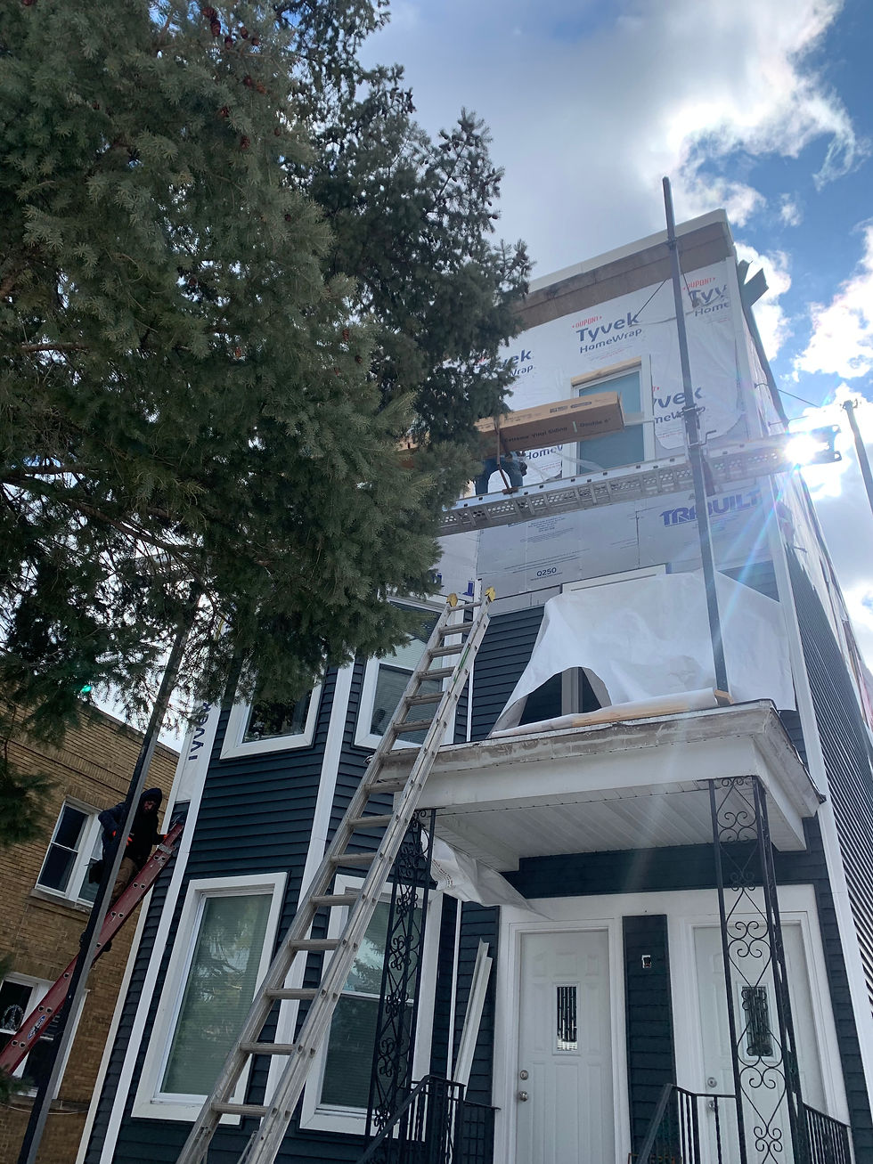 Hail damage on aluminum siding replacement on Warwick Ave in Chicago through homeowners Insurance by TomKat Restoration
