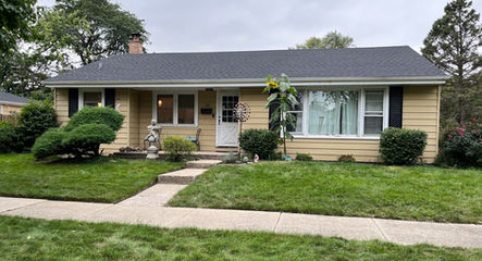 Hail damage on aluminum siding in Mount Prospect - 20 Prospect Manor - Insurance claim approved through TomKat Restoration - Material replaced with James Hardie