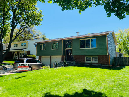 Aluminum siding hail damage in Mount Prospect approved through homeowners insurance claim through TomKat Restoration