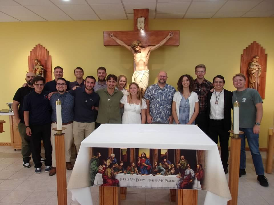 group of people at the altar of a Catholic church
