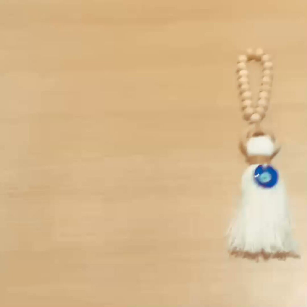 Miniatura: Colgante de madera con Ojo Turco y borla