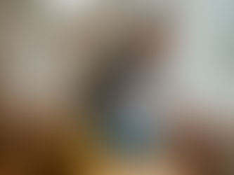 Woman cleaning baseboard in new home