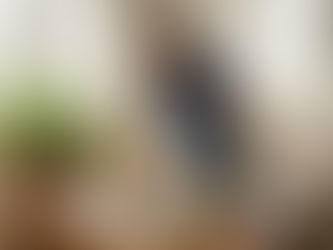 Woman deep cleaning living room table