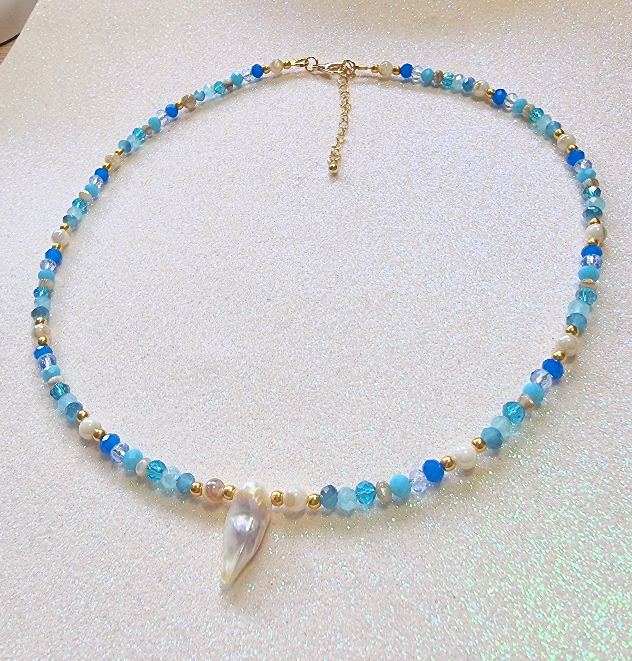 Blue glass beaded necklace with pearl charm