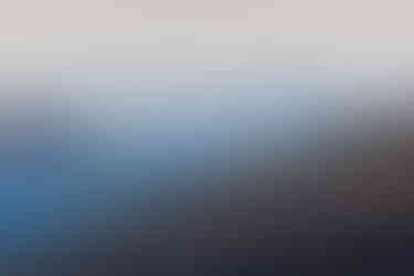 Layered hillsides of the Ehrbach valley in blue spring haze, with forested slopes in the foreground and a bright, open landscape receding into the distance