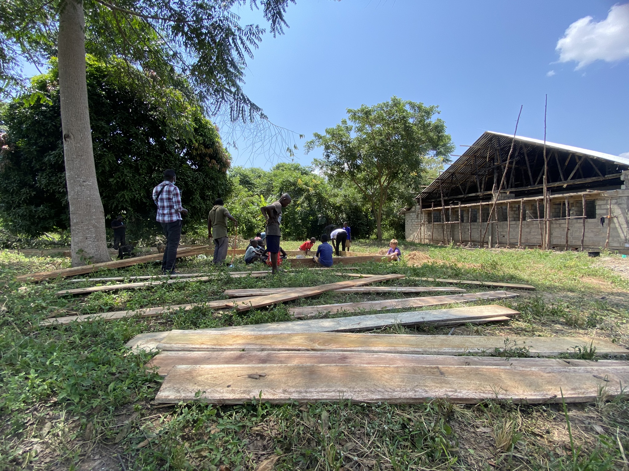Jim Forbis, Mike Owens, and Kelly Snodgras meeting with Dr. Alfred Okidi in Kampala