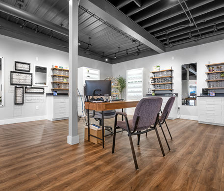 Modern office interior with wooden floors and exposed ceiling