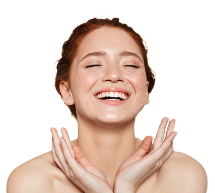 Smiling woman with glowing skin and hands on neck