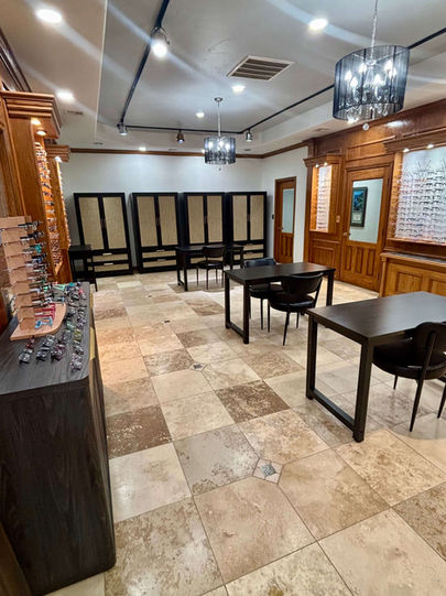 Optical showroom with glasses displays and consultation tables