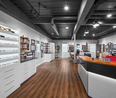 Modern optometry office interior with glasses on display.