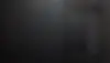 DALL·E 2024-11-13 08.29.17 - A dark, minimalist background image for a professional portfo