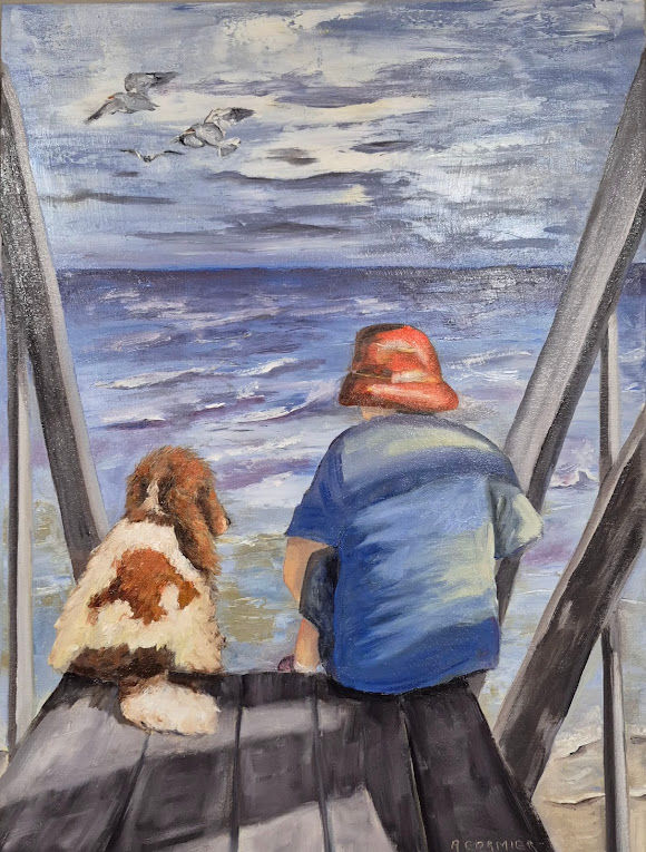 Chien et enfant regardant la mer. Complicité.